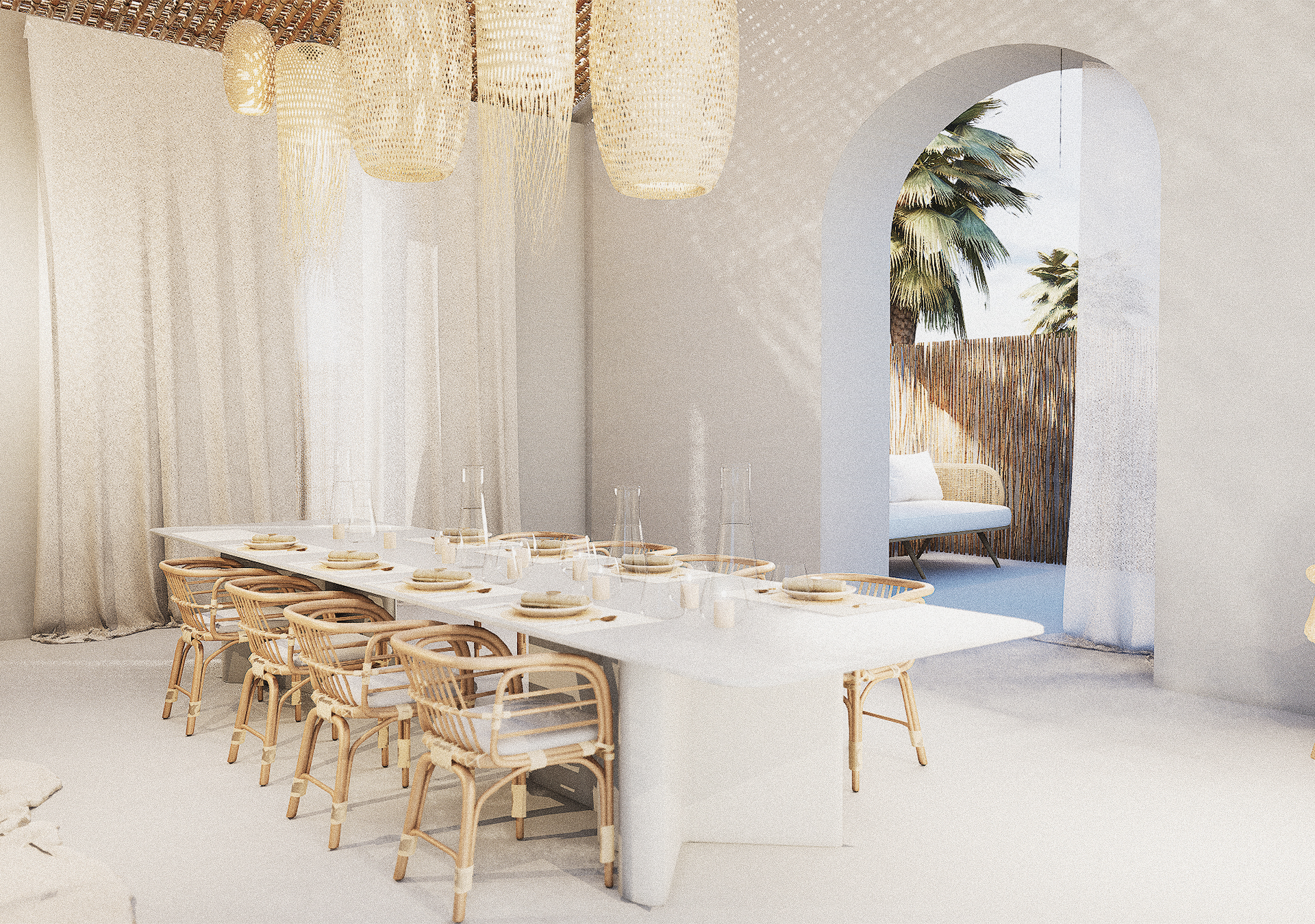 A Mediterranean-style dining room with a white table, wicker chairs, and woven pendant lights, opening through an archway to a sun-drenched patio.